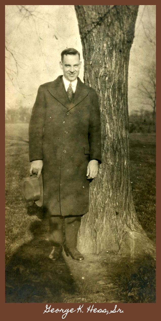 George Kellogg Hess, Sr. next to tree holding hat